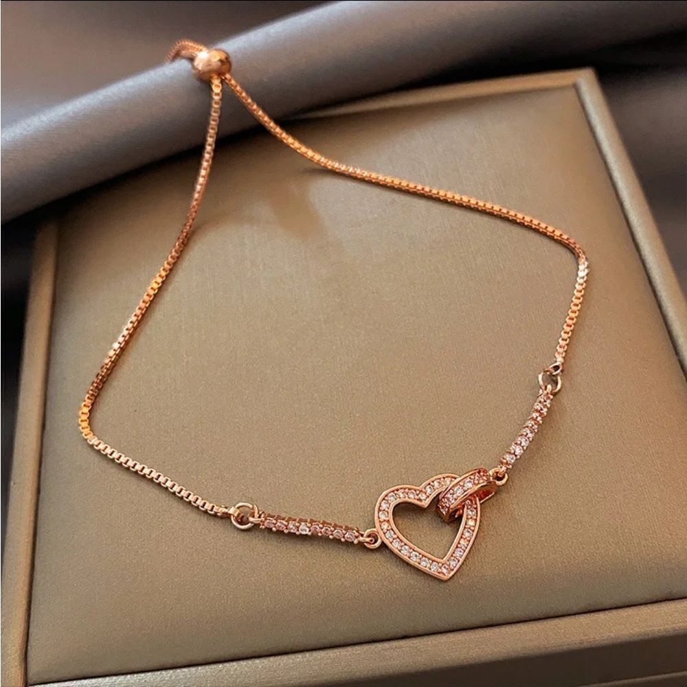The Rose Gold Heart Chakra Slide Closure bracelet with heart pendant.
